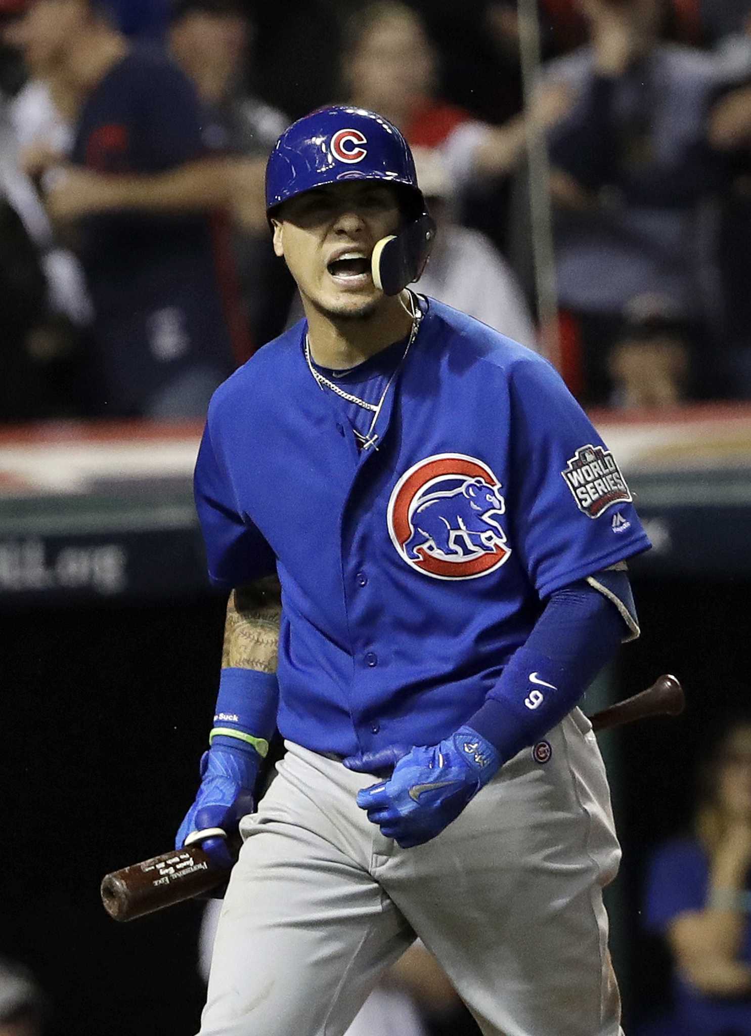 Chicago Cubs' Javier Baez hits a home run against the Cleveland Indians  during the fifth inning of Game 7 of the Major League Baseball World Series  Wednesday, Nov. 2, 2016, in Cleveland. (