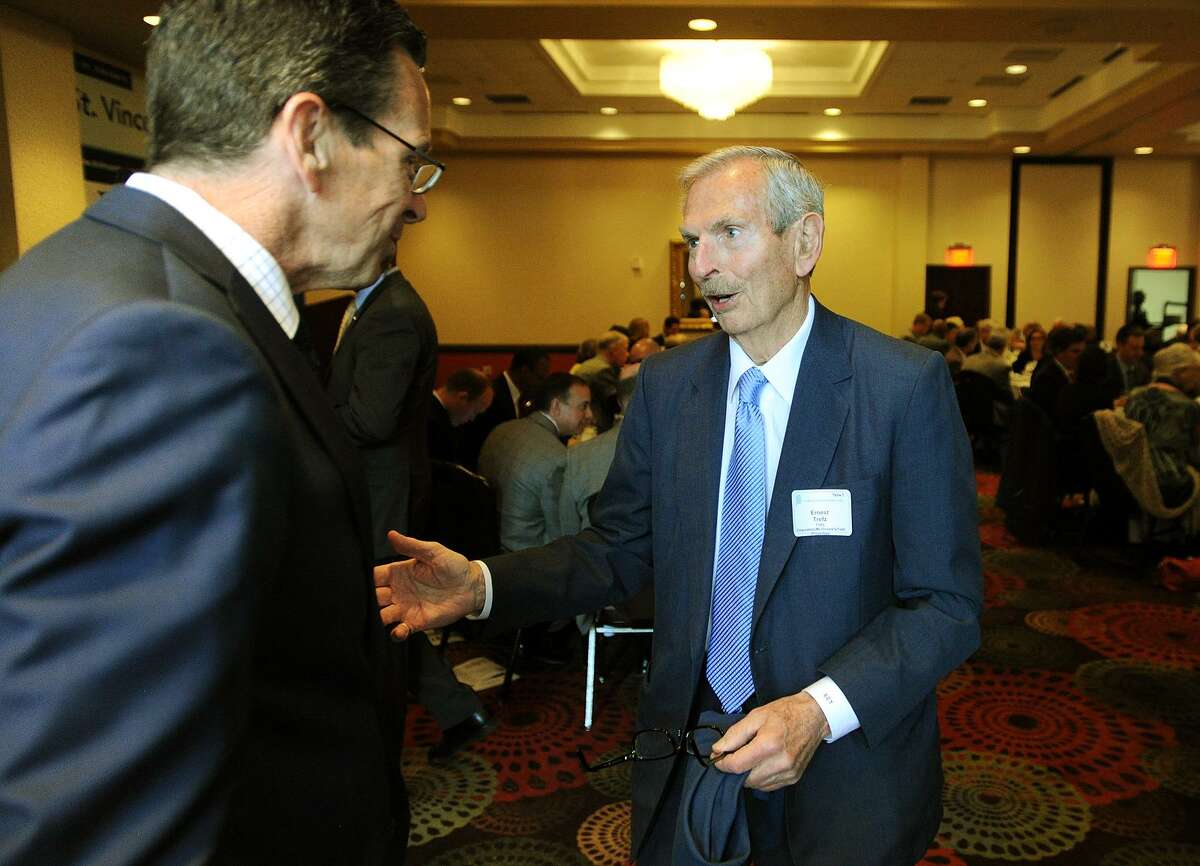 Governor Dannel P. Malloy, left, chats with Ernest Trefz of Trefz Corporation at the Bridgeport Regional Business Council's Capitol Luncheon at the Holiday Inn in Bridgeport, Conn. on Thursday, April 16, 2015.