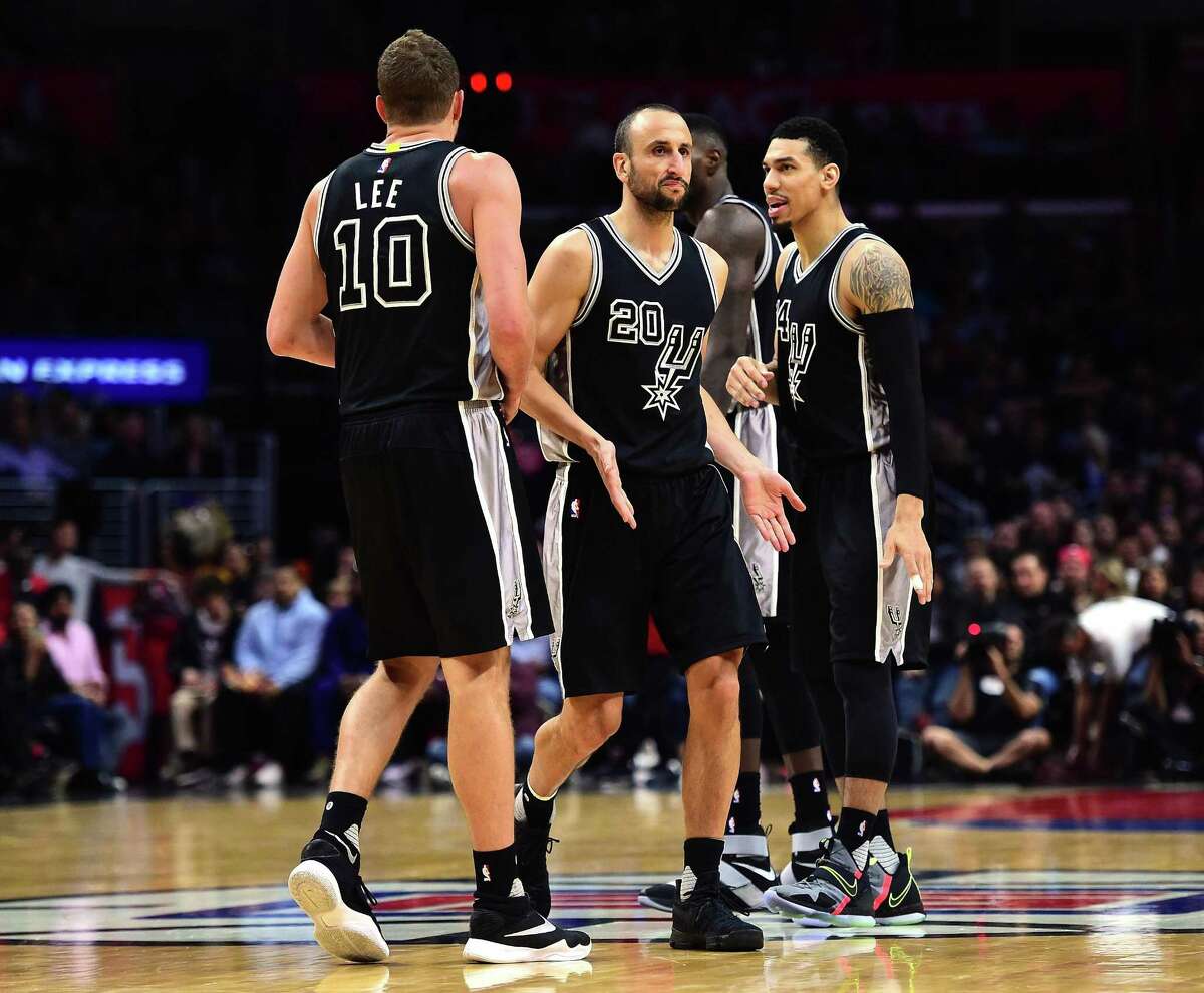 LOS ANGELES, CA - FEBRUARY 24: Manu Ginobili #20 of the San Antonio Spurs celebrates his play with David Lee #10 and Danny Green #14 during a 105-97 win over the LA Clippers at Staples Center on February 24, 2017 in Los Angeles, California. NOTE TO USER: User expressly acknowledges and agrees that, by downloading and or using this photograph, User is consenting to the terms and conditions of the Getty Images License Agreement. (Photo by Harry How/Getty Images)