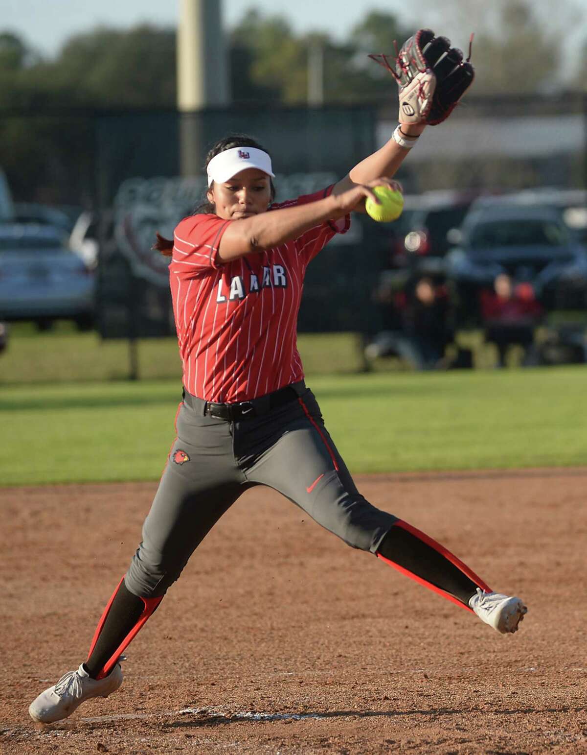 Lamar's Ciara Luna fires off a pitch from the mound as they face Big 12 opponent Kansas Saturday. Photo taken Saturday, February 25, 2017 Kim Brent/The Enterprise