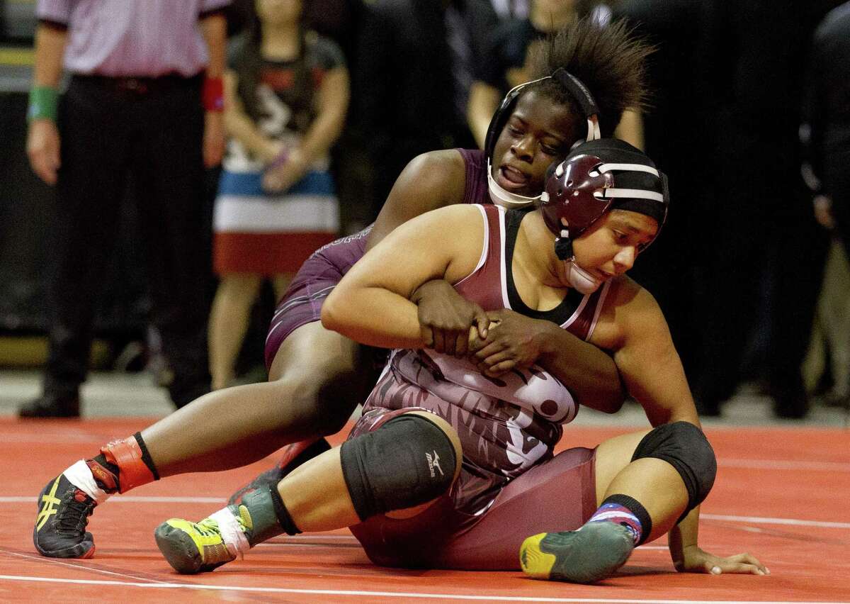 Adelyhda Perez Uvalde tries to break a hold from Za?• Maia Marshall of A&M Consolidated in the Class 5A girls 148-pound championship final at the UIL Wrestling State Championships Saturday, Feb. 25, 2017, in Cypress.