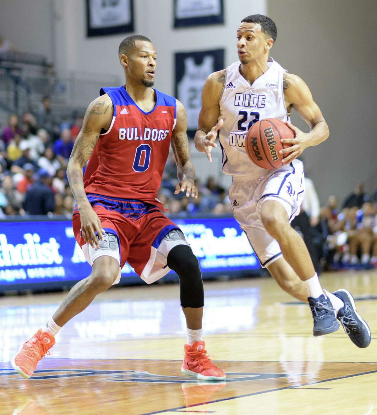 Marcus Jackson (22) of the Rice Owls brings the ball up the court with Jocobi Boykins (0) of the Louisiana Tech Bulldogs defending in a college basketball game on Saturday, February 25, 2017 at Tudor Fieldhouse on Rice Campus.