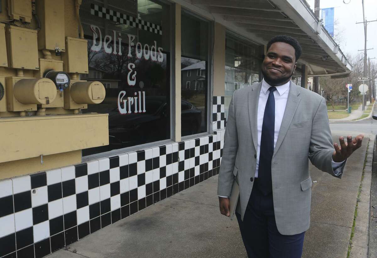 Akeem Brown, Director of Operations for Sage (San Antonio for Growth on the East Side), is pushing for development and progress on San Antonio's East Side. Brown is brokering deals to attract business and commerce on the East Side, and helping small business owners such as Sergio Calderon who owns the Panchos and Gringos Deli (background) on Nolan Street.