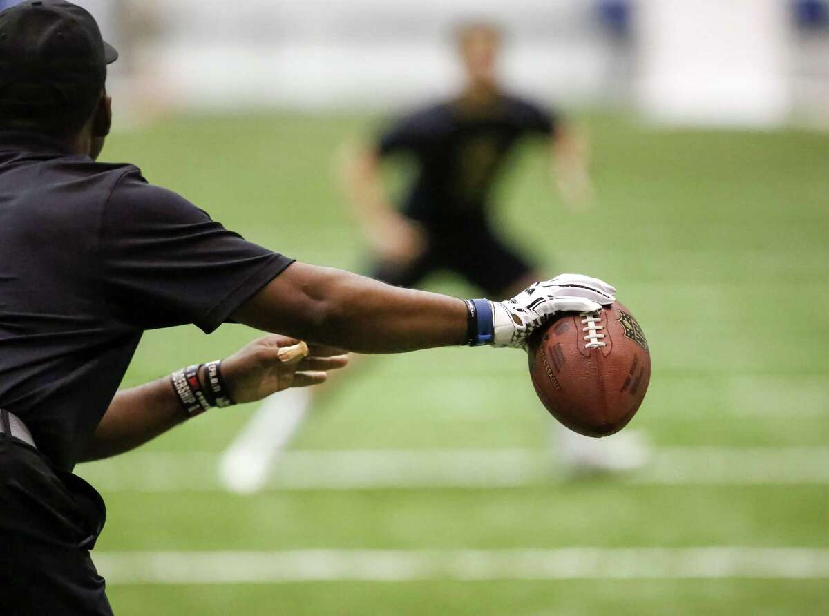 A player reacts to the movement of the ball during drills at the NFL football regional combine at the New Orleans Saints training facility in Metairie, La., Sunday, March 13, 2016. (AP Photo/Scott Threlkeld)