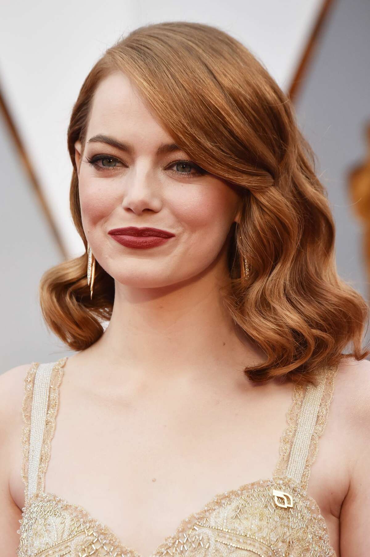 Actor Emma Stone wears a Planned Parenthood pin while attending the 89th Annual Academy Awards at Hollywood & Highland Center on February 26, 2017 in Hollywood, California.