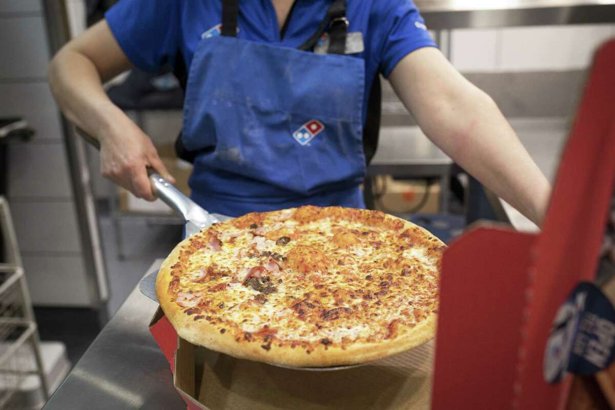 Order a Domino's pizza online through Sunday and receive a 50-percent discount. >>Click to see fast-food chains with the most caloric dishes.