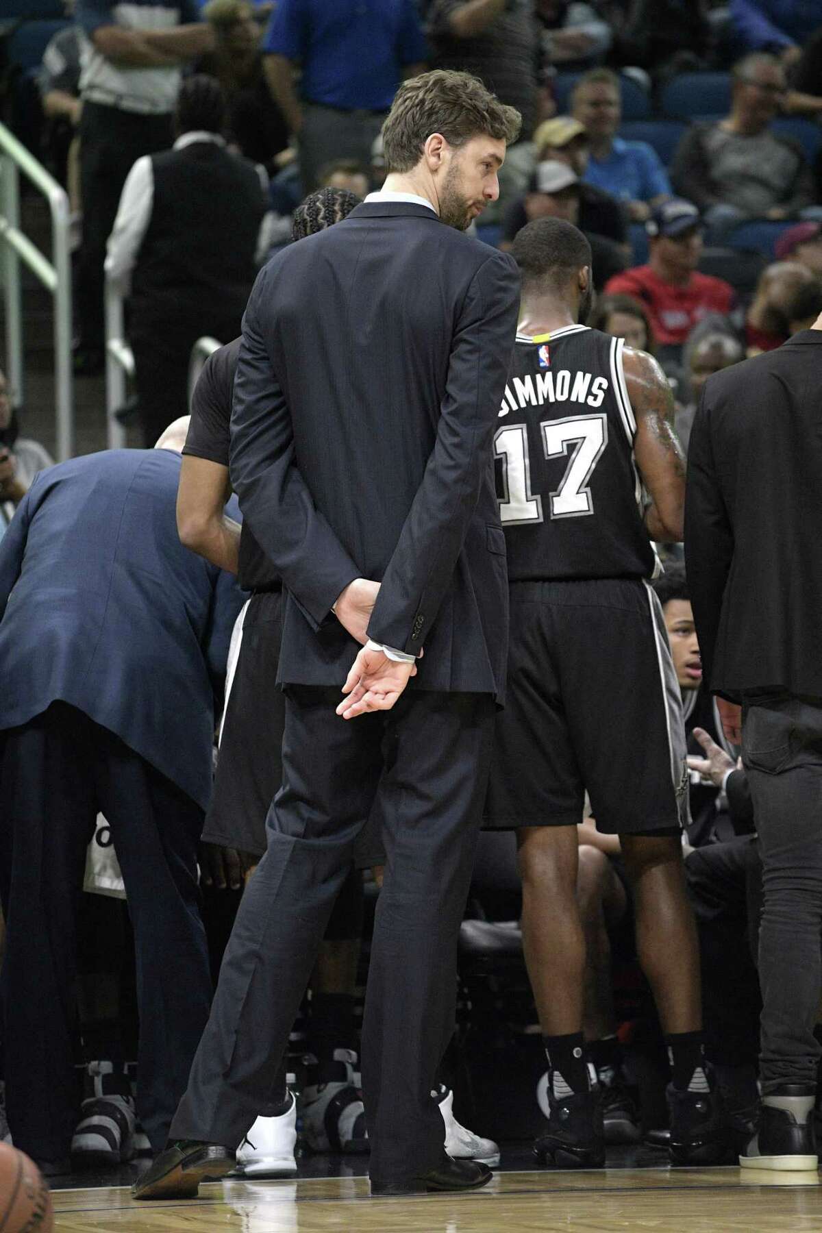 San Antonio Spurs center Pau Gasol stands outside a huddle during a timeout in the second half of an NBA basketball game against the Orlando Magic in Orlando, Fla., Wednesday, Feb. 15, 2017. The Spurs won 107-79. (AP Photo/Phelan M. Ebenhack)