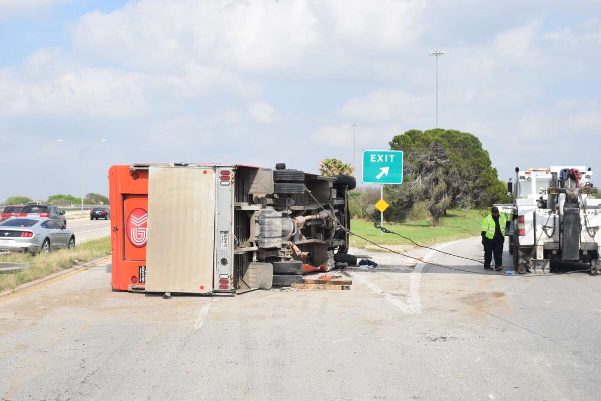 Traffic on Interstate 35 was slowed down Monday, Feb. 27, 2017, after a delivery truck driver drove over a barrier and flipped his truck.