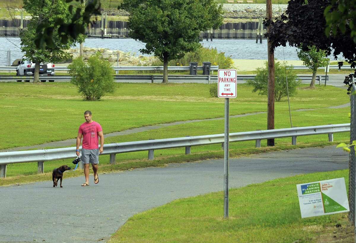 Brian Fama of Stamford walks his dog Wall-E on Thursday, Sept. 29, 2016. The city held the first public input session Tuesday night for the Boccuzzi Park Master Plan. The city has hired Hamden-based Stantec Consulting to come up with design alternatives for the park within the next year.