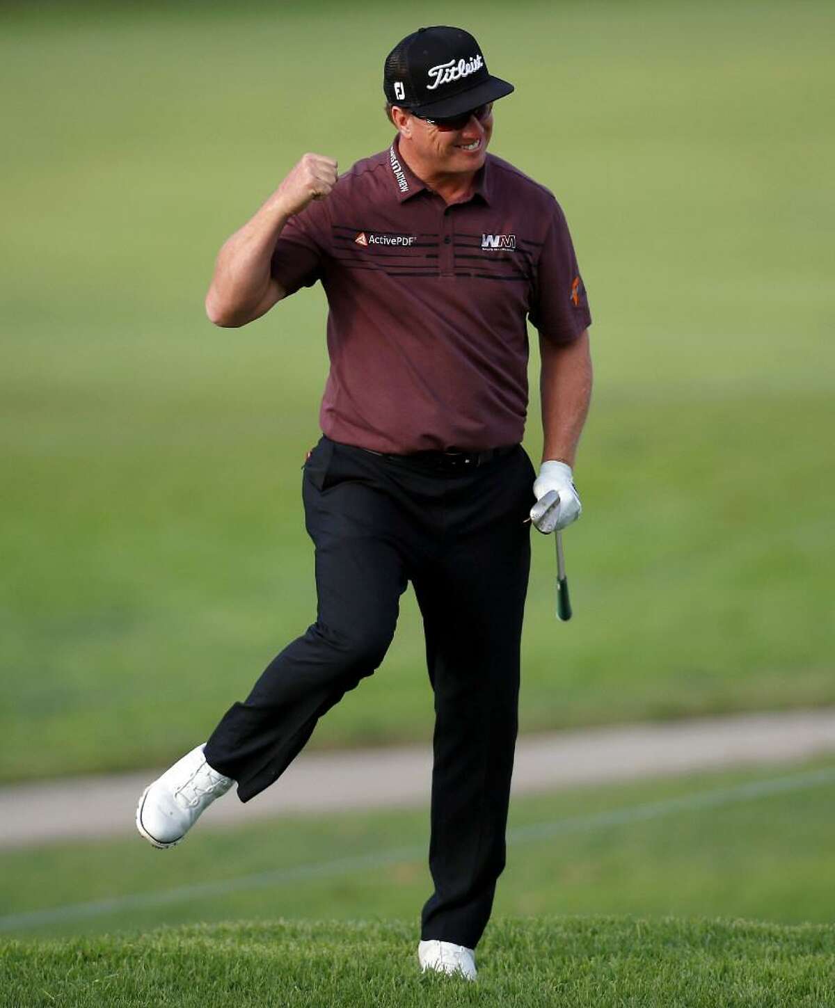 Charley Hoffman reacts after chipping in to save par on the 15th hole during the final round of the Genesis Open golf tournament at Riviera Country Club Sunday, Feb. 19, 2017, in the Pacific Palisades area of Los Angeles.