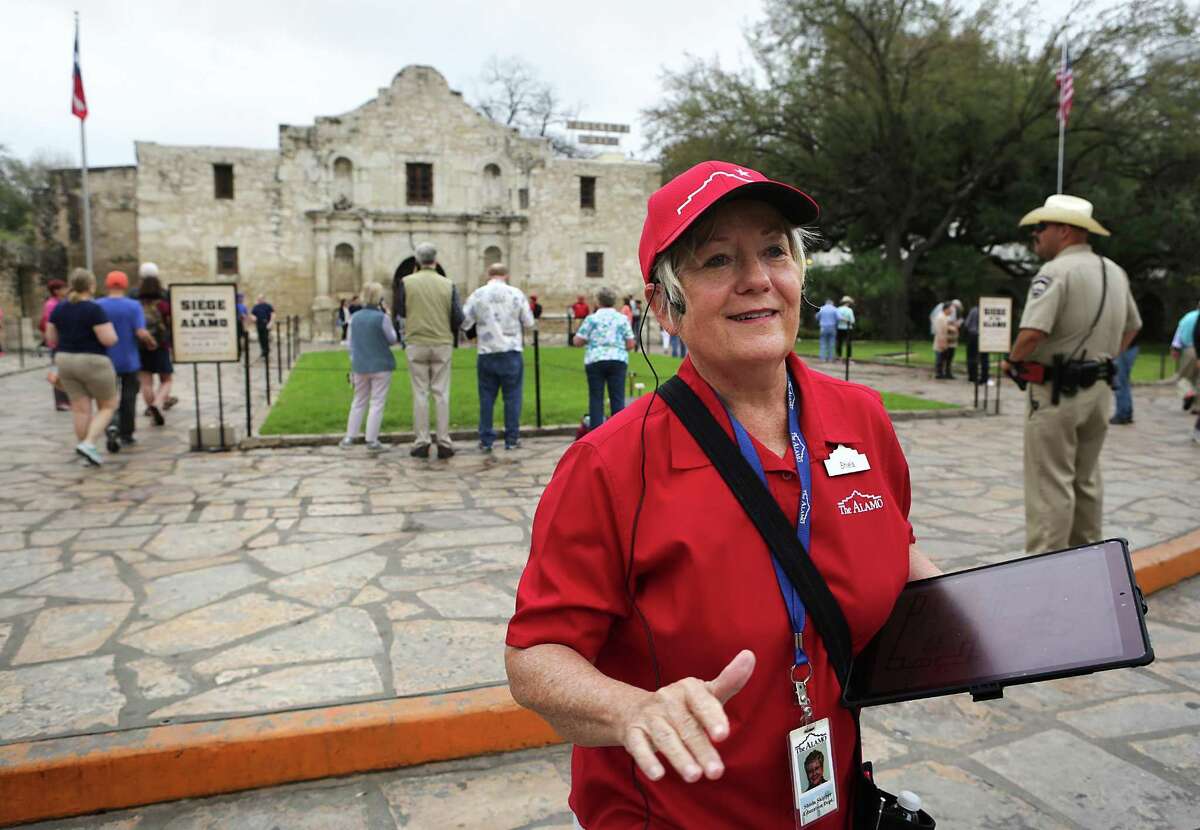 Shiela Skipper, a tour guide at the Alamo, gives a tour to staff members using new equipment and training curriculum which will be put in place on March 4. The Alamo will also open it's new exhibit, "Bowie: Man-Knife-Legend".