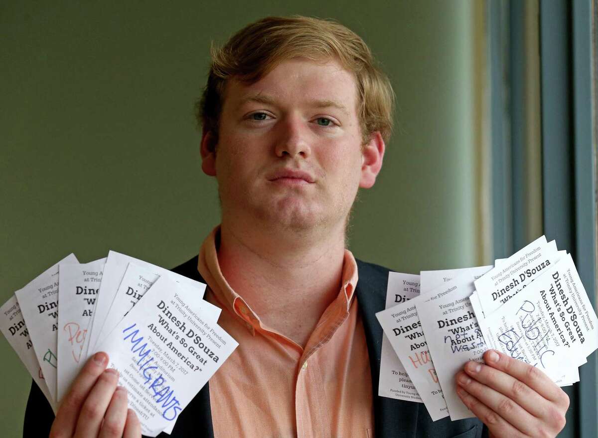 Portrait of Trinity University sophomore Jonah Wendt, 19 with vandalized fliers for a speech by Dinesh D'Souza, at the university Monday Feb. 27, 2017. Wendt is the field director and chief financial officer of Tigers for Liberty.