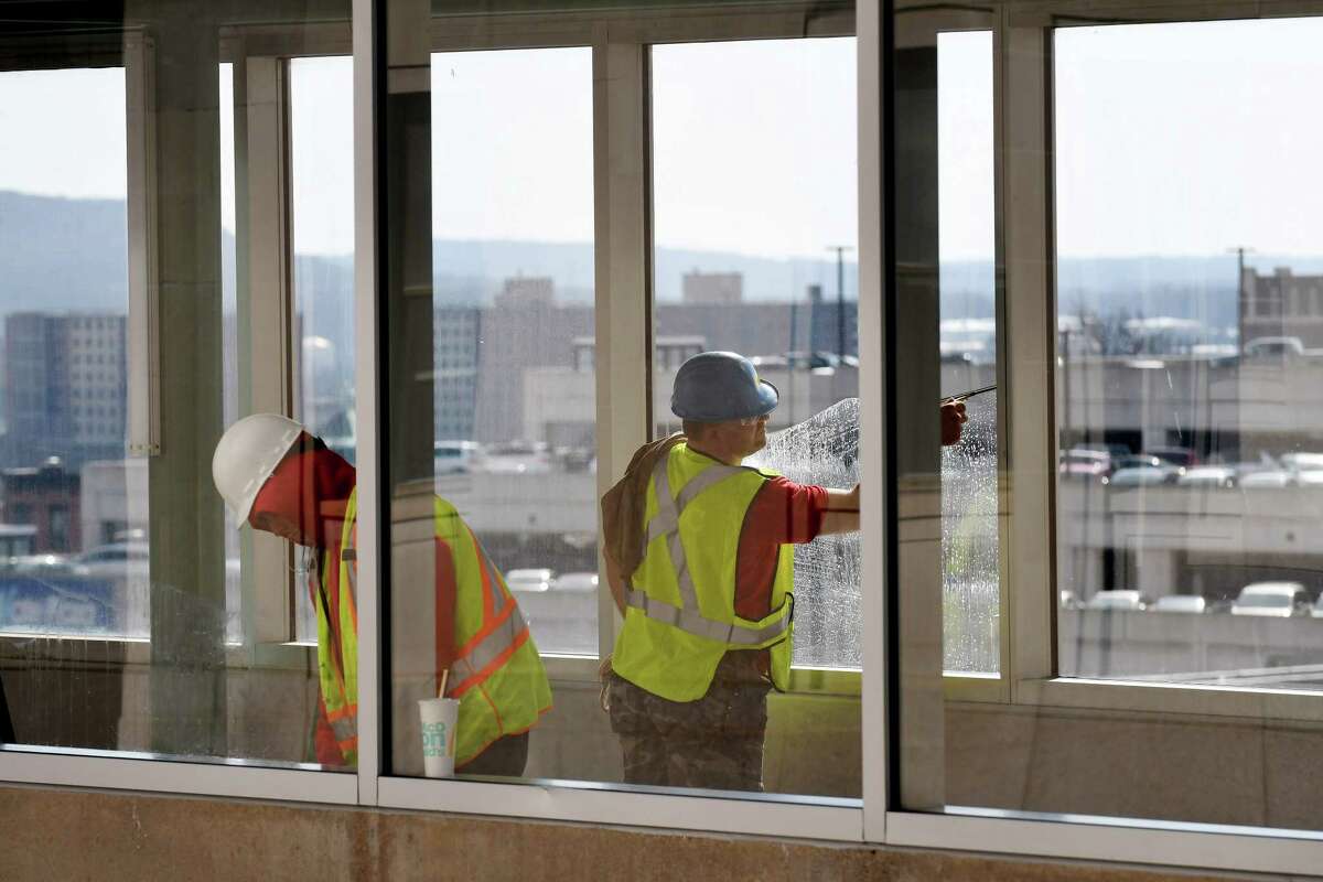 Windows are cleaned in the walkway connecting the Empire State Plaza to the Albany Capital Center and Times Union Center on Tuesday, Feb. 28, 2017, in Albany, N.Y. The Capital Center is scheduled to open this week. (Will Waldron/Times Union)