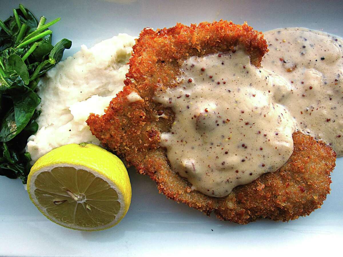 Veal schnitzel with mashed potatoes, wilted spinach and andouille gravy from Bryans on 290