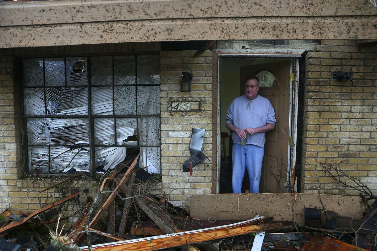 Greg Goza stands in the doorway of his mother-in-law’s home after a tornado swept through a neighborhood in North Central San Antonio recently. A reader applauds the city for coming to the aid of the tornado victims.