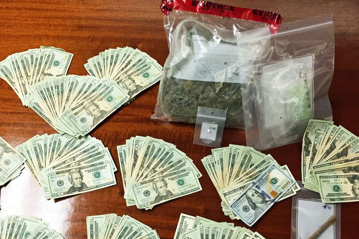Money, marijuana, heroin, and ecstasy allegedly recovered from the car of Chad Davis, 33. He was arrested by Westport police on charges of drug possession. Tuesday, Feb. 28, 2017.