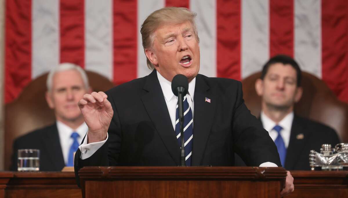 President Donald J. Trump (C) delivers his first address to a joint session of the U.S. Congress as U.S. Vice President Mike Pence (L) and Speaker of the House Paul Ryan (R) listen on February 28, 2017 in the House chamber of the U.S. Capitol in Washington, DC. Trump's first address to Congress is expected to focus on national security, tax and regulatory reform, the economy, and healthcare.