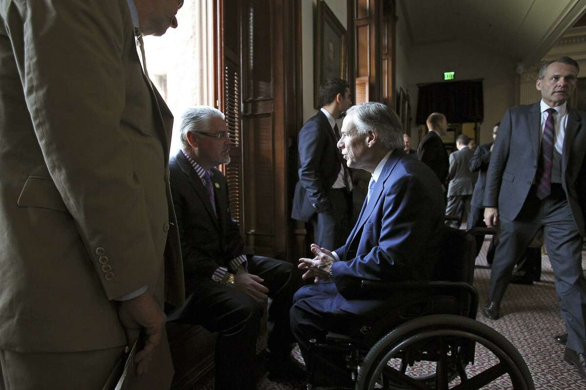 Rep. Dan Huberty, seen chatting with Gov. Greg Abbott, chairs the House Public Education Committee.