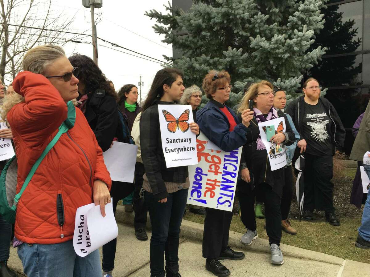 About 25 members of the Columbia County Sanctuary Movement and Capital Region-based New Sanctuary for Immigrants rallied against deportations outside the U.S. Department of Homeland Security in Latham on Wednesday, March 1, 2017. (Emily Masters / Times Union)