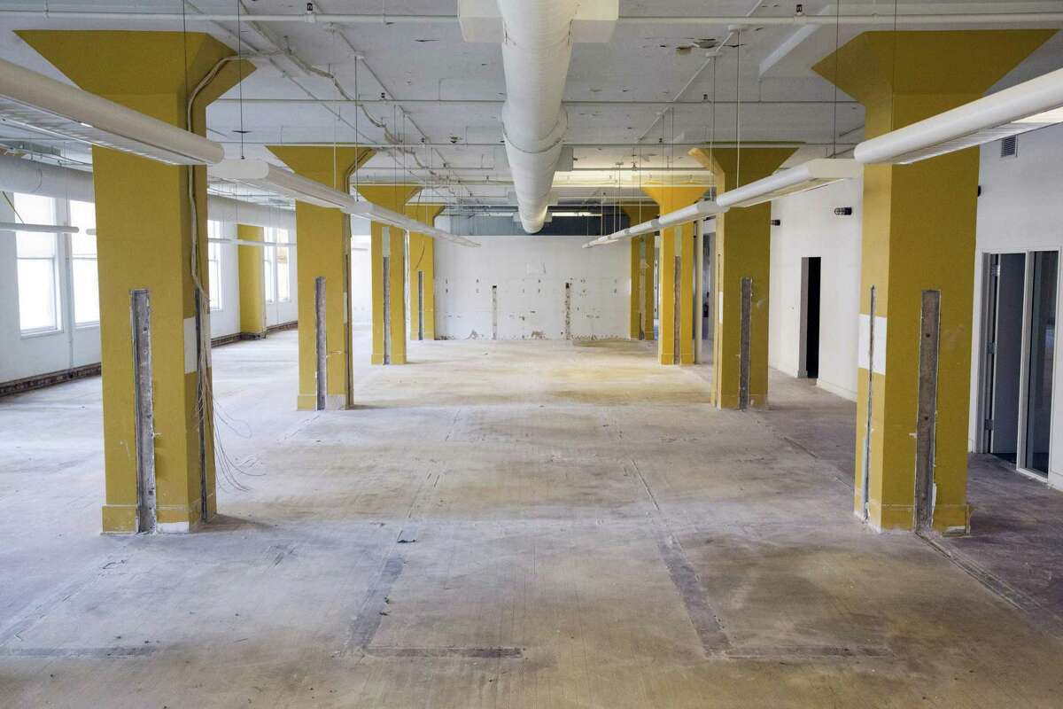 Cubicles have been removed on the second floor of the Burns building on Houston Street. Developer David Adelman plans to renovate the space into creative office space with open floor plans.