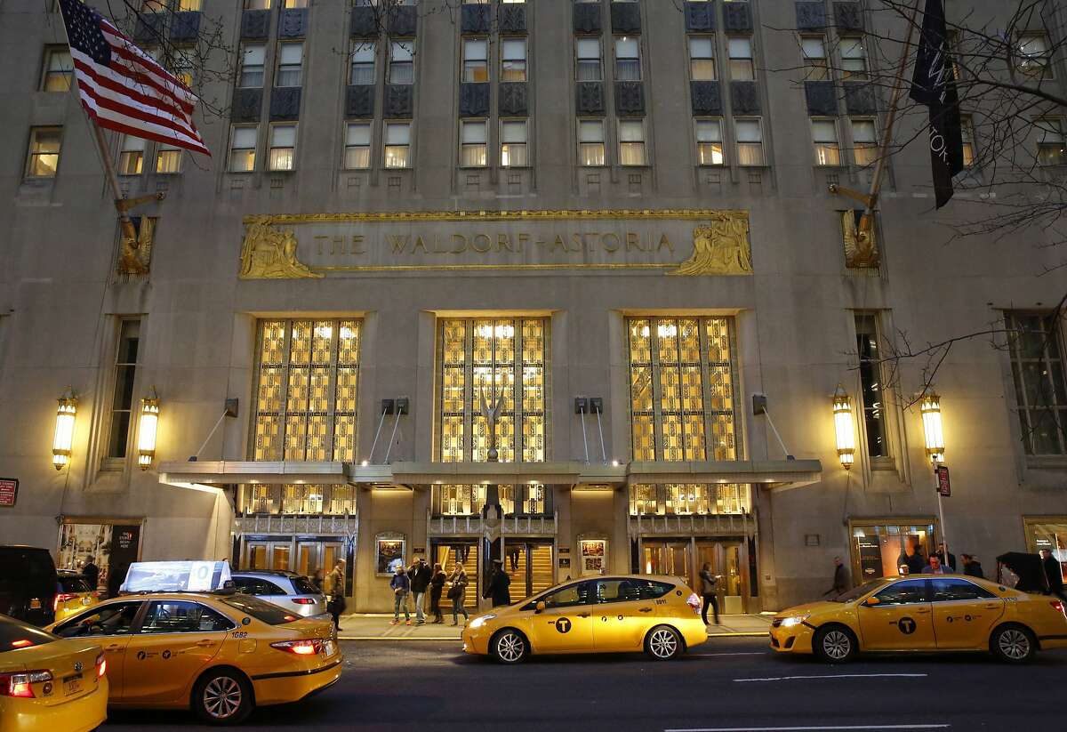 Taxis pull up in front of the renowned Waldorf Astoria hotel in New York on Tuesday, Feb. 28, 2017. The hotel, purchased by the Anbang Insurance Group, a Chinese company, is closing Wednesday for two to three years for renovation. Exact details of the renovation haven't been released, but its conversion into a hybrid of private residences and a smaller hotel follows a model set by another landmark New York City hotel, The Plaza. (AP Photo/Kathy Willens)
