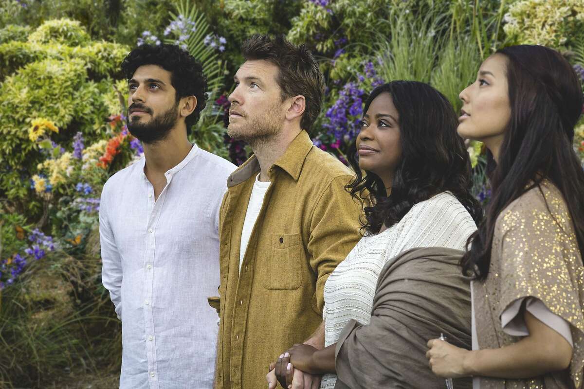 Sam Worthington (second from left) plays Mac, a father who speaks with God in the religious drama "The Shack."