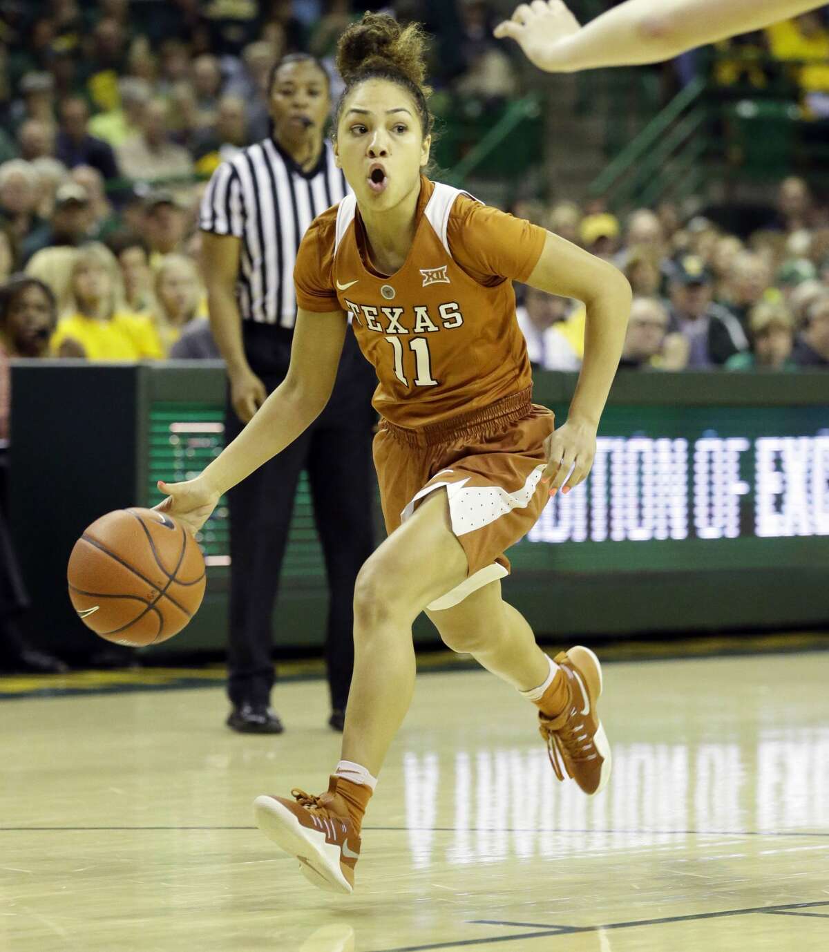 Texas guard Brooke McCarty (11) dribbles during the second half of an NCAA college basketball game against Baylor in Waco, Texas, Monday, Feb. 6, 2017. (AP Photo/LM Otero)