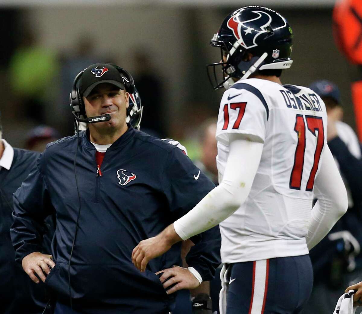 Houston Texans head coach Bill O'Brien stands by quarterback Brock Osweiler (17) as he walks to the sidelines during a time out during the fourth quarter against the Oakland Raiders of an NFL football game at Estadio Azteca on Monday, Nov. 21, 2016, in Mexico City. ( Brett Coomer / Houston Chronicle )