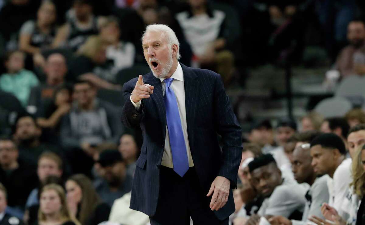 San Antonio Spurs head coach Gregg Popovich directs his players during the first half of an NBA basketball game against the Indiana Pacers, Wednesday, Oct. 24, 2018, in San Antonio. (AP Photo/Eric Gay)