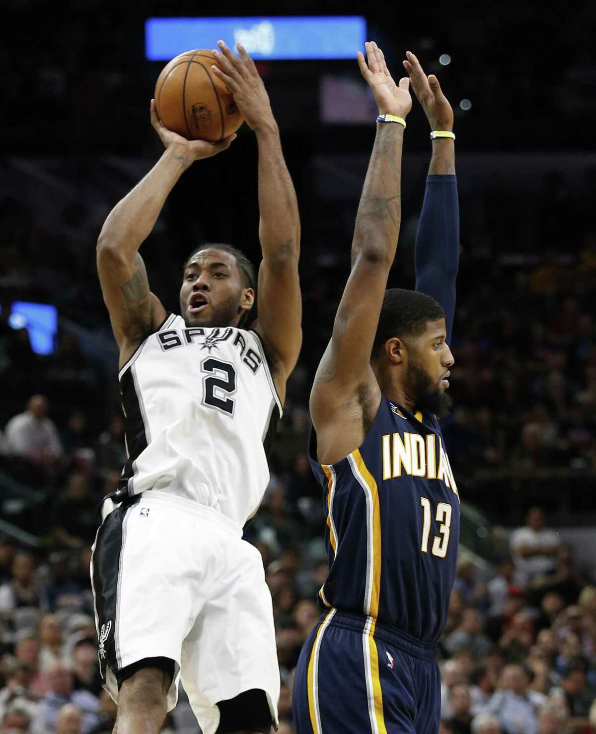 ***This is NOT the GAME WINNING shot*** Spurs?’ Kawhi Leonard (02) scores after getting fouled by Indiana Pacers?’ Paul George (13) during their game at the AT&T Center on Wednesday, Mar. 1, 2017. Spurs defeated the Pacers, 100-99. (Kin Man Hui/San Antonio Express-News)