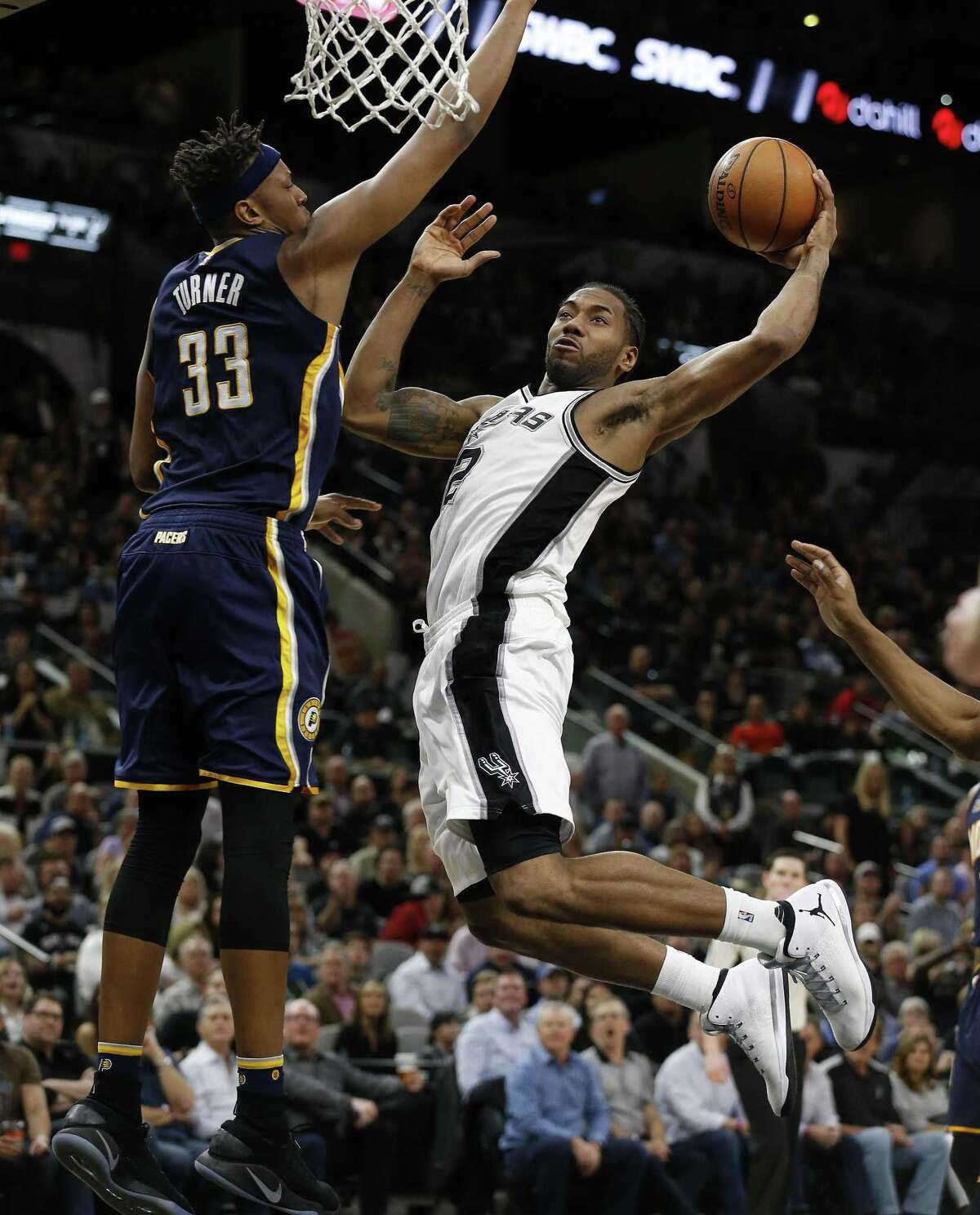 Spurs?’ Kawhi Leonard (02) gets fouled before attempting a shot by Indiana Pacers?’ Myles Turner (33) during their game at the AT&T Center on Wednesday, Mar. 1, 2017. Spurs defeated the Pacers, 100-99. (Kin Man Hui/San Antonio Express-News)