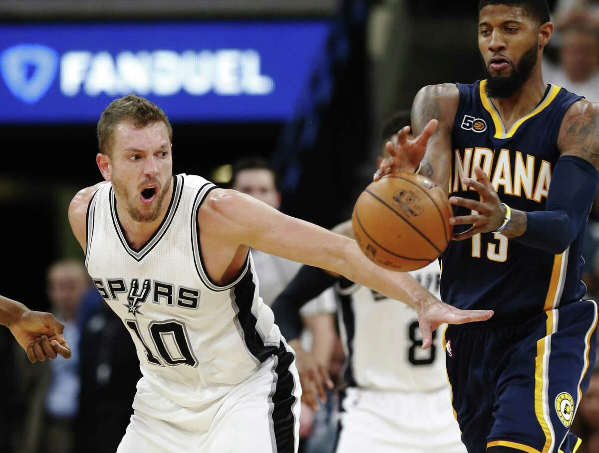 Spurs?’ David Lee (10) competes for a loose ball against Indiana Pacers?’ Paul George (13) during their game at the AT&T Center on Wednesday, Mar. 1, 2017. Spurs defeated the Pacers, 100-99. (Kin Man Hui/San Antonio Express-News)