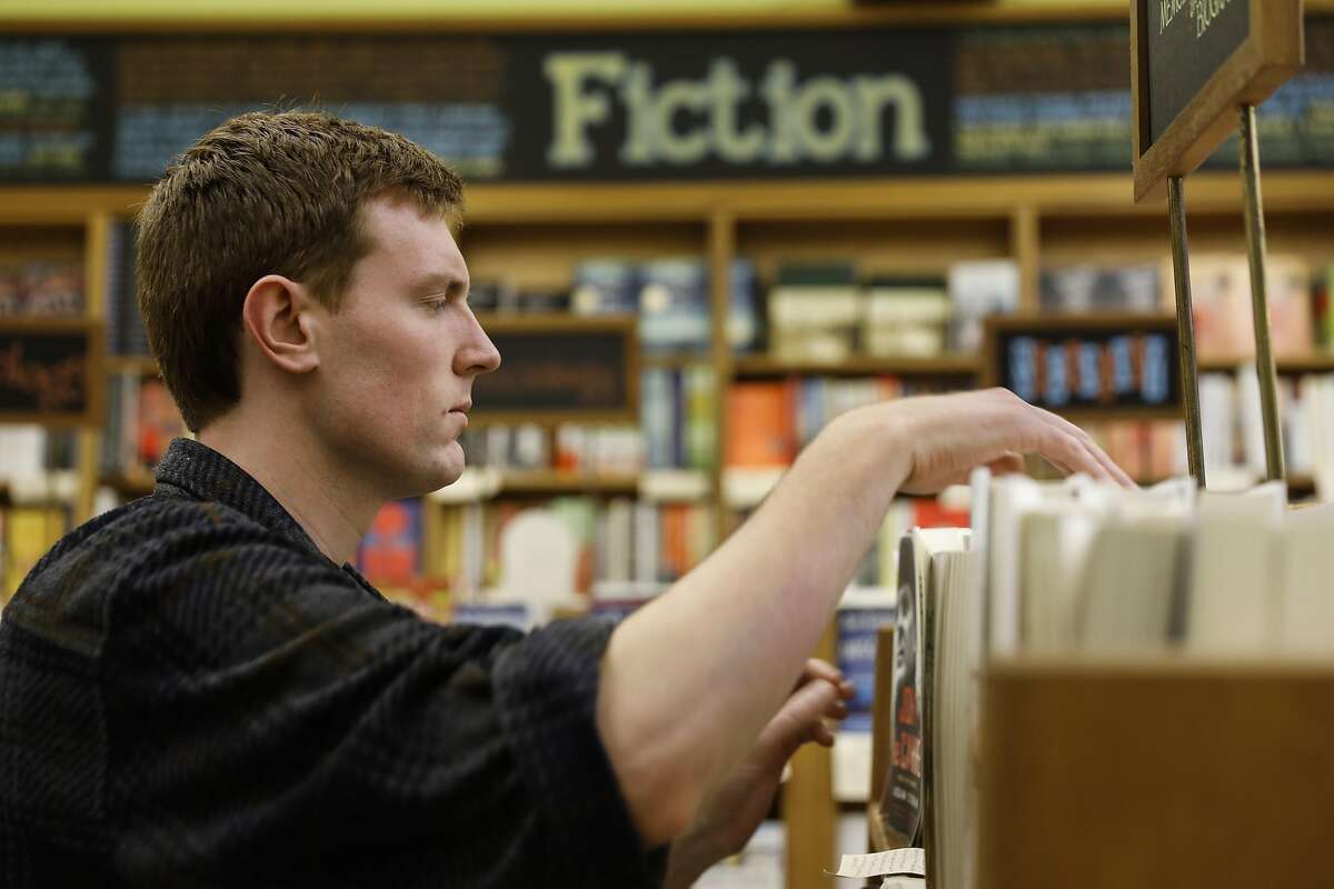 Chris Philpot from red state Utah, working at Booksmith bookstore as seen in San Francisco, California on Wednesday March 1, 2017.