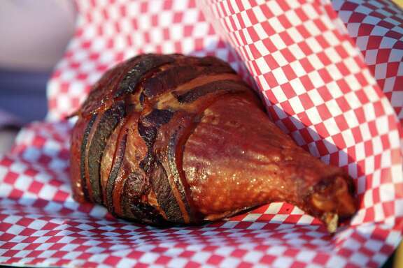 New food stand named "Get Pickled" sells bacon wrapped turkey legs in the Midway of the Houston Livestock Show and Rodeo on Feb. 27, 2014, in Houston. ( Mayra Beltran / Houston Chronicle )