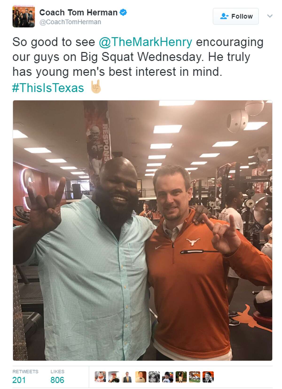 Texas coach Tom Herman poses with WWE superstar Mark Henry. 