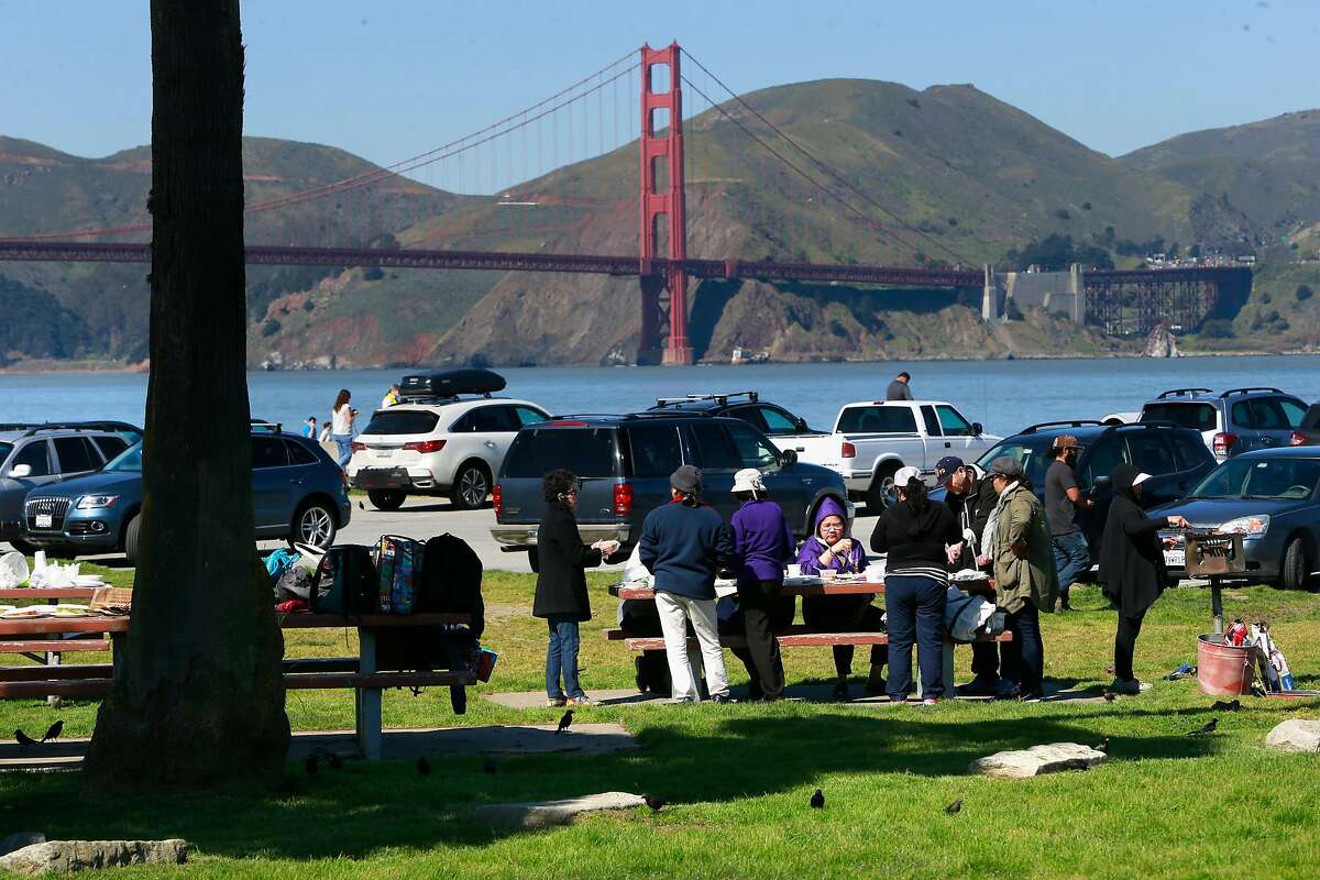 Visitors enjoy the picnic area at the east end parking lot area at Crissy Field in San Francisco, Ca. on Thurs. March 2, 2017. Major renovations to the park are about ready to begin.