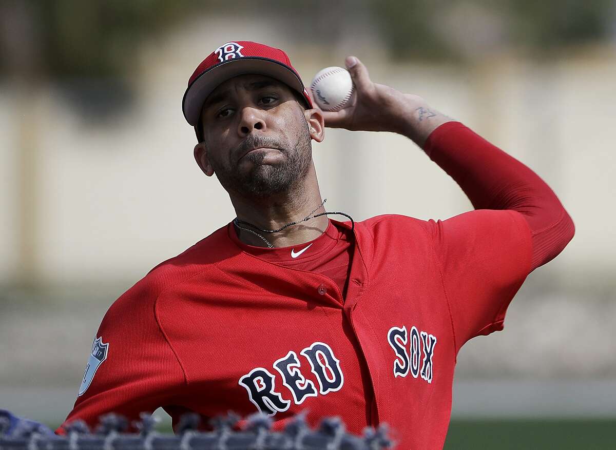FILE - In this Feb. 19, 2017, file photo, Boston Red Sox pitcher David Price throws a live batting session at a spring training baseball workout in Fort Myers, Fla. Red Sox left-hander David Price was scratched from his first spring training start and will consult with specialists after experiencing soreness in his left forearm and elbow. (AP Photo/David Goldman, File)