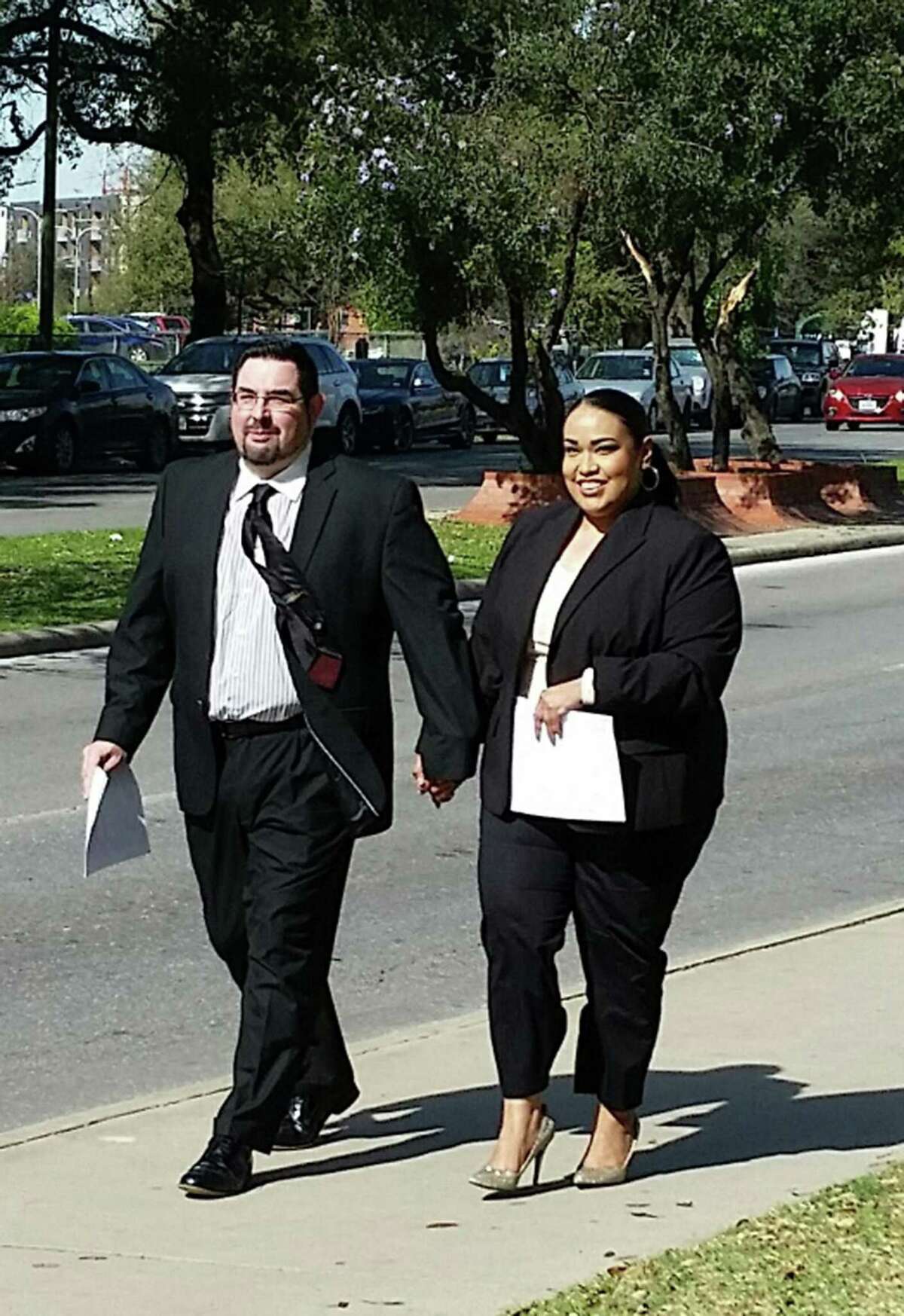 Eric Jon Alva and Jessica Rivas Alva leave federal court in San Antonio on Thursday after pleading guilty to defrauding immigrants.