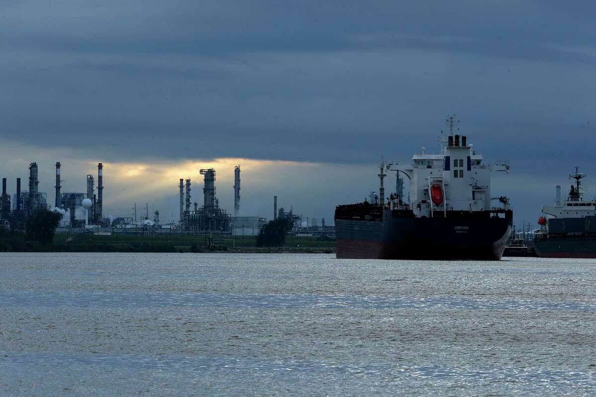 With a refinery that could be vulnerable to hackers behind it, a ship navigates through Buffalo Bayou heading to the Houston Ship Channel earlier this year.
