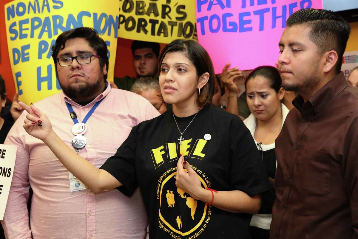 Rose Escobar, accompanied by Familias Immigrantes y Estudiantes en la Lucha (FIEL) representatives Abraham Espinosa, left, and Ceser Espinosa, denounces the Trump Administration for deporting undocumented immigrants who do not have criminal records instead of criminals at a press conference Thursday, March 2, 2017, in Houston. Escobar's husband, Jose Escobar, 31, was deofrted Thursday. Jose Escobar came to the United States from El Slvador without legal status at the age of 15.