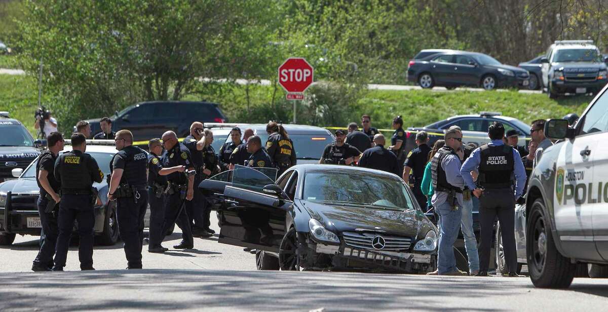 Suspected bank robbers in a black Mercedes sedan led police on a high-speed chase across Houston highways and through some neighborhoods Friday, March 3, 2017, in Houston. About 11:15 a.m. two suspects bailed from the sedan on Styers Street, near the Loop 610 interchange with the North Freeway. The chase ended at the junction of Enid, Amasa and Melbourne streets and the North Freeway feeder by Lindale Church of Christ.