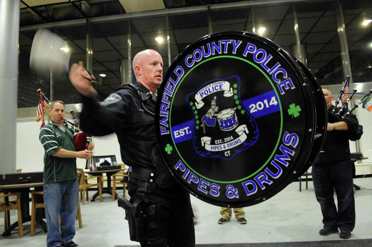 Stamford police officer Chris Brown practices playing the bass drum for the Fairfield County Police Pipes & Drums band. The group, comprised of police officers from Stamford, Norwalk and Bridgeport, formed three years ago and will perform Saturday in the Stamford St. Patrick’s Day parade.