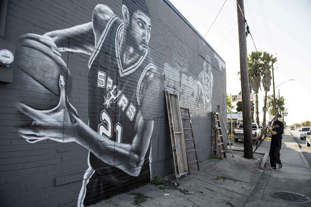 Well known area artist Nick Soupe is canvassing the side of the bar with an enormous mural dedicated to Tim Duncan at Franky Diablo's on Thursday, February, 23, 2017.