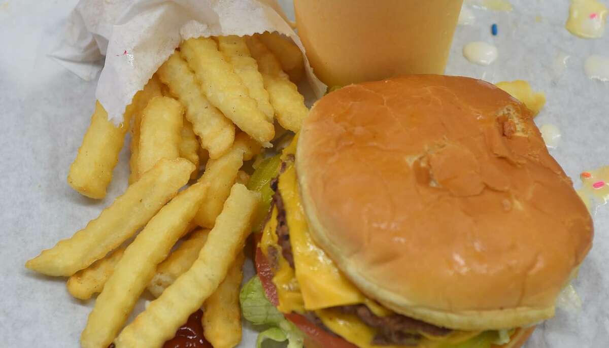 A burger boy, fries, and an orange shake from Burger Boy.