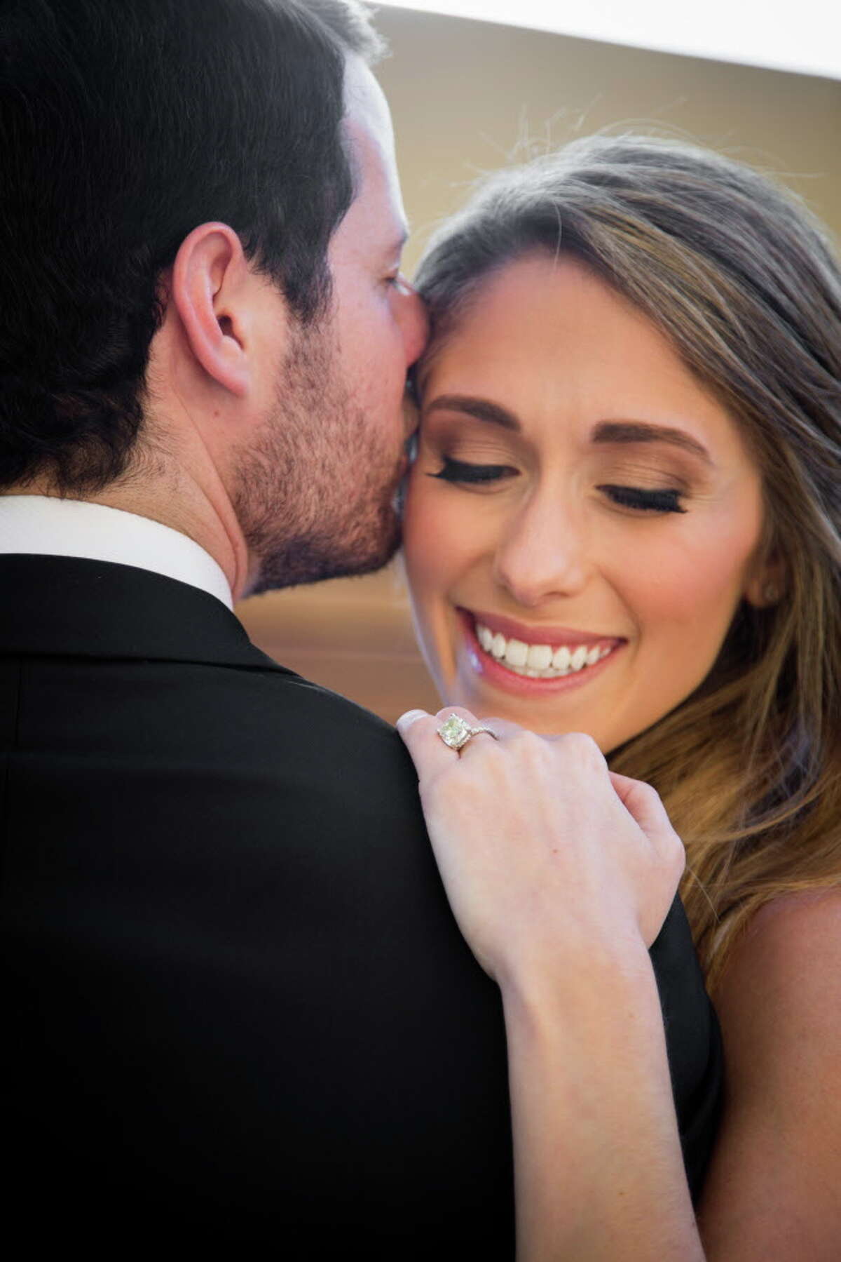 Family friends tie the knot at Four Seasons, one floor above bride's office