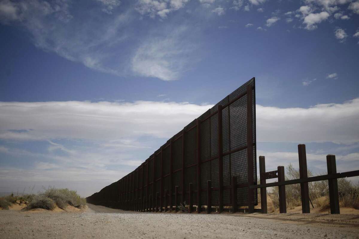 A border fence separates the U.S. and Mexico in Santa Teresa, New Mexico. A bigger, bolder border wall would do nothing about the 40 percent of the immigrants in the U.S. who become unauthorized by overstaying their visas.