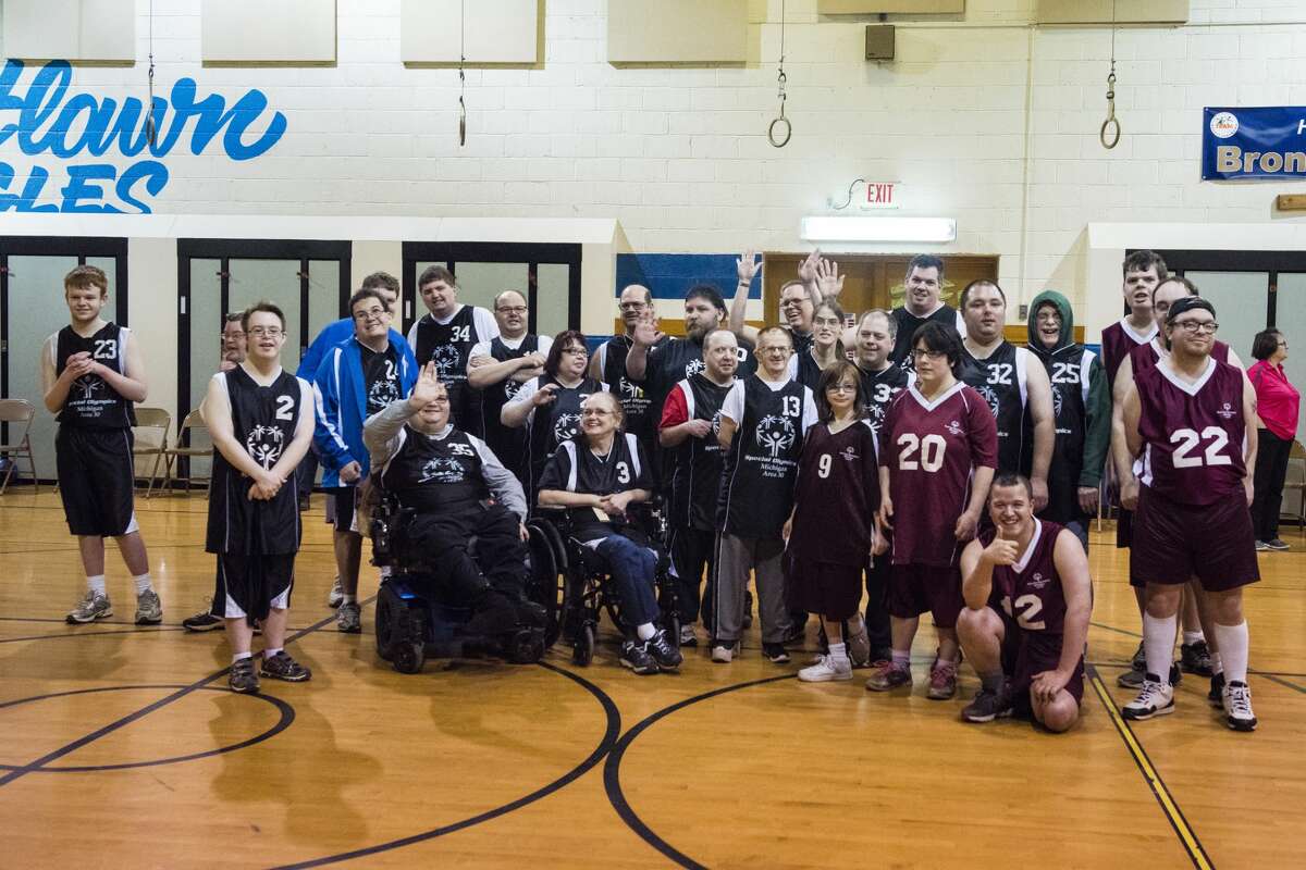Athletes pose for a picture during the Special Olympics Skills Tournament on Friday at Eastlawn Elementary School in Midland. More than 30 athletes from Midland, Bay City and Roscommon competed for medals.
