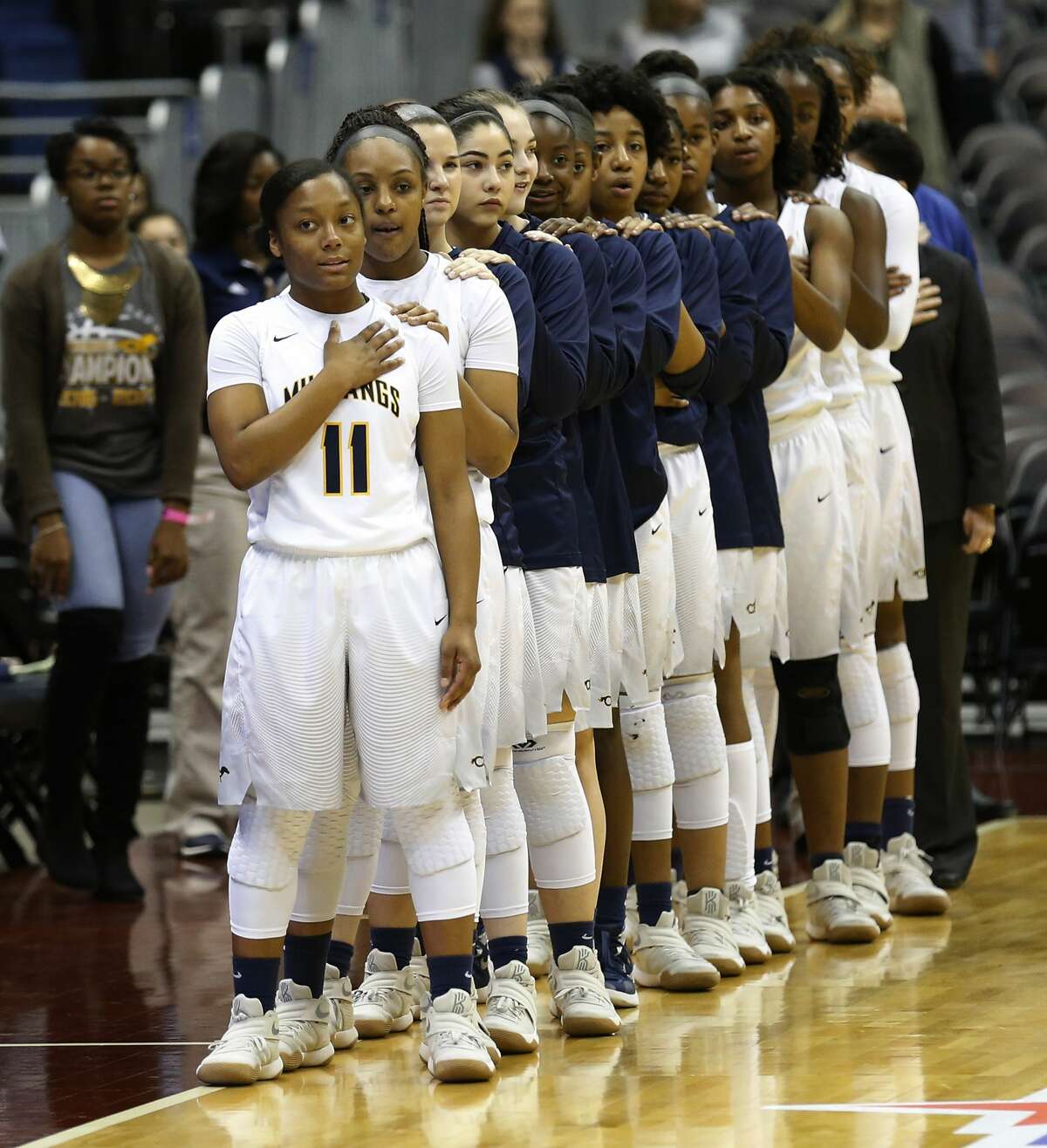 The Houston Cypress Ranch girls basketball team stand for the national anthem before their game against Pflugerville in the UIL Girls Class 6A State Semifinal basketball game at the Alamodome in San Antonio on Friday, Mar. 3, 2017. (Kin Man Hui/San Antonio Express-News)
