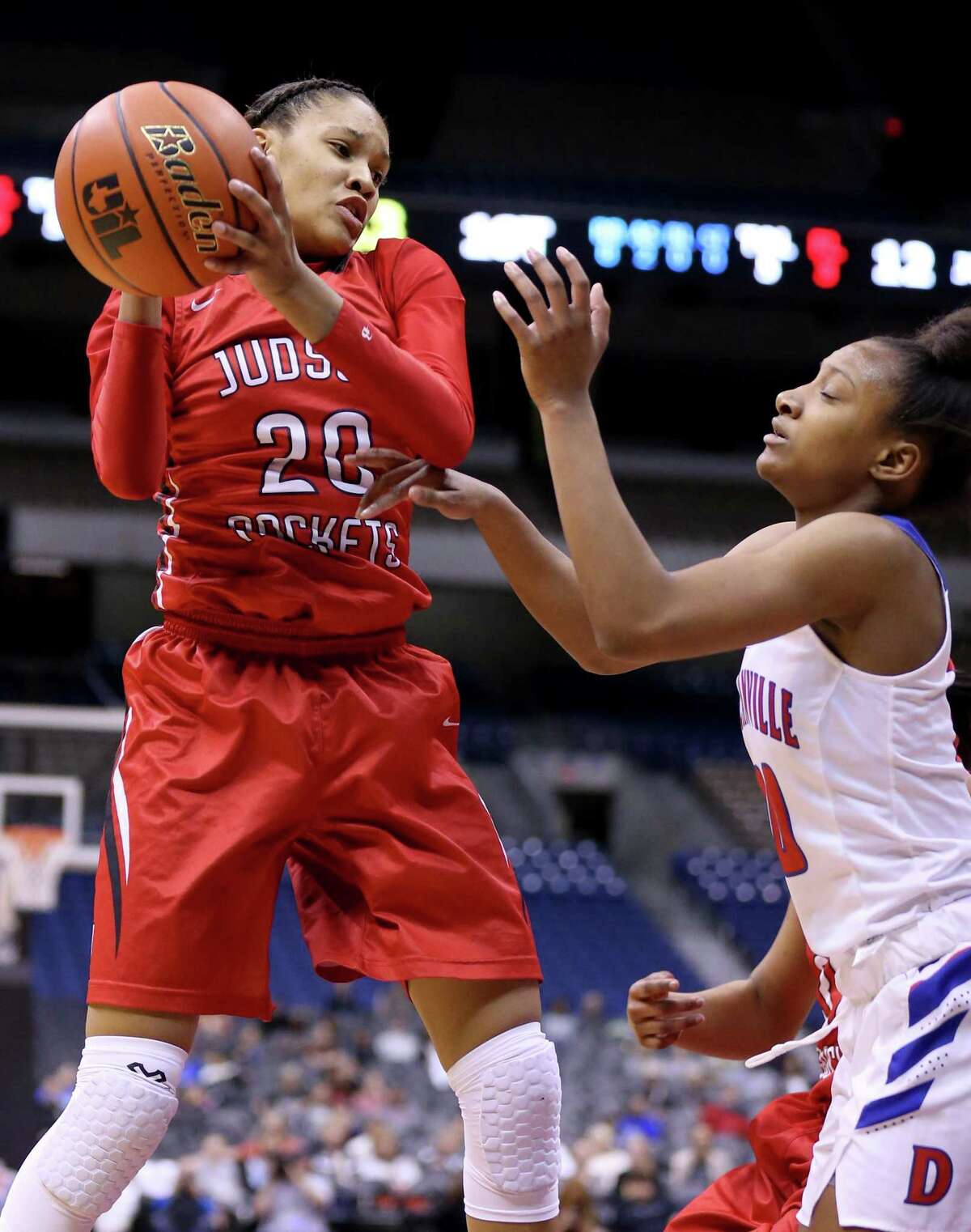 Judson's Tiffany McGarity grabs a rebound around Duncanville's Aniya Thomas during first half action of their Class 6A state semifinal game held Friday March 3, 2017 at the Alamodome.