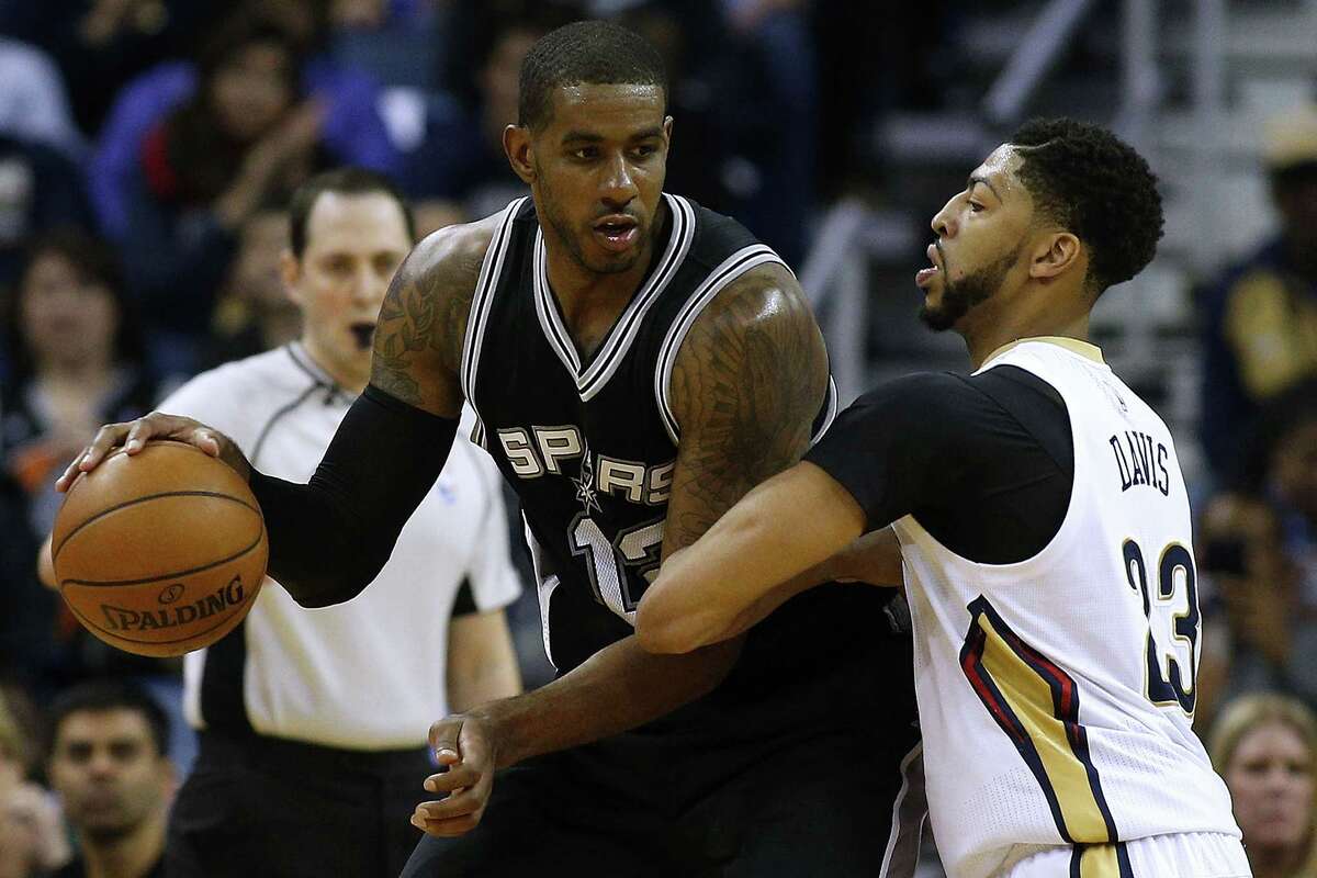 NEW ORLEANS, LA - MARCH 03: LaMarcus Aldridge #12 of the San Antonio Spurs drives against Anthony Davis #23 of the New Orleans Pelicans during the second half of a game at the Smoothie King Center on March 3, 2017 in New Orleans, Louisiana. NOTE TO USER: User expressly acknowledges and agrees that, by downloading and or using this photograph, User is consenting to the terms and conditions of the Getty Images License Agreement.